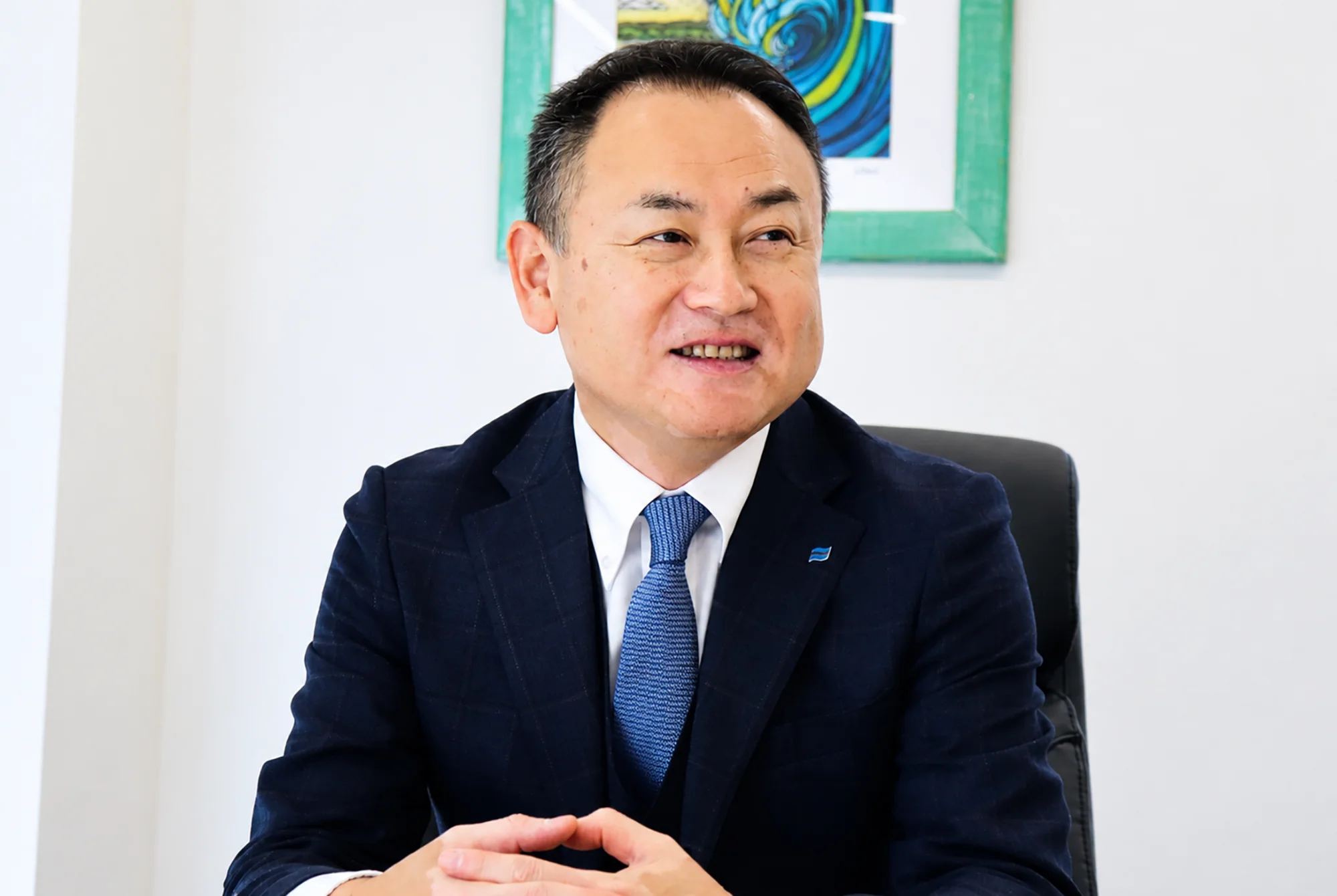 インタビューに答える代表取締役社長
